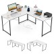L-shaped computer desk in white with power outlets, monitor shelf, and ample workspace for gaming and writing.