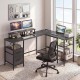 L-shaped black desk with monitor stands, open shelves, and built-in power outlet for versatile office use.