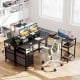 L-shaped black desk with monitor stands, adjustable shelves, and built-in power outlet for versatile office use.