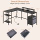 L-shaped black desk with power outlet, adjustable shelves, and monitor stands, ideal for home office or gaming setup.