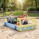 Large car-themed sandbox in blue with fir wood frame, featuring a rotatable rudder for imaginative play and storage for.