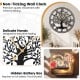 Large 27-inch black metal wall clock with tree of life design, featuring delicate hands and hidden battery box for easy.