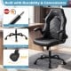 Ergonomic black leather office chair with flip-up armrests, smooth rolling casters, and robust 5-claw metal base.