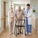 Lightweight aluminum mobility walker with padded seat, 2 wheels, and adjustable height for seniors' comfort and support.