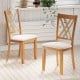 Natural wooden dining chairs with linen fabric upholstery, featuring an X-shaped backrest for comfort and ventilation.