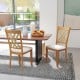 Wooden dining chairs with linen upholstery and X-shaped design, perfect for comfort in a natural dining room setting.