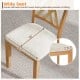 Wide seat of linen fabric upholstered dining chair with rubber wood frame, designed for comfort and stability in dining.