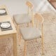 Set of 2 modern dining chairs with padded linen fabric seats and curved backs, featuring oak-like metal legs for.