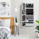 Lockable wall-mounted jewelry cabinet with a spacious interior, featuring organized hooks and compartments for.