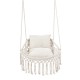Macrame swing chair hammock in beige with two removable cushions, featuring chic fringes for indoor or outdoor use.