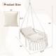 Macrame swing chair hammock in beige with two removable cushions, featuring a sturdy metal frame and bohemian design.