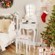White makeup dressing table with fan-shaped mirror, three drawers, and cushioned stool, perfect for girls' rooms.