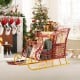 Two-tiered metal Christmas Santa sleigh basket in red and gold, ideal for storing gifts and holiday decorations.