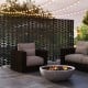 Freestanding black metal privacy screen with hollowed design, ideal for outdoor spaces and climbing plants.