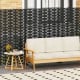 Freestanding black metal privacy screen with H-shaped legs, ideal for indoor or outdoor use and stylish ventilation.