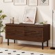 Mid Century fluted TV stand in walnut with metal legs, featuring hidden compartments for organized storage and cable.