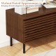 Mid Century fluted TV stand in walnut with metal legs, featuring hidden compartments for elegant storage and.
