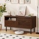 Mid Century fluted TV stand in walnut with open compartment and drawer, perfect for modern entertainment setups.