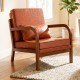 Modern accent chair with brown faux leather upholstery and removable cushions, perfect for living rooms or reading.