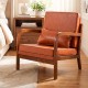 Modern accent chair in brown faux leather with removable cushions, perfect for living rooms or reading areas.