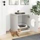 Modern cat litter box enclosure in white, featuring an open door and a playful cat nearby for stylish pet care.