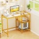 Modern console table with golden metal frame, two open shelves, and a spacious glass top, perfect for stylish office.