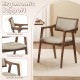 Modern dining chair with ergonomic support, rubber wood frame, and beige fabric, perfect for kitchen or dining room use.