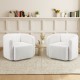 Two white sherpa accent chairs with curved backrests, perfect for cozy living room seating and stylish decor.