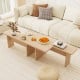 L-shaped modular coffee table set in oak, featuring rounded corners and space-saving design for small spaces.