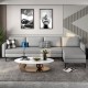 Light gray modular L-shaped sectional sofa with reversible ottoman, USB ports, and ergonomic backrests for comfort.
