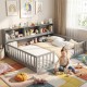 Montessori twin floor bed and gray toy storage cabinet with toys, creating an organized and playful environment for.