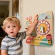 Montessori wooden educational clock toy for toddlers, featuring colorful sliders and seasonal themes, mounted on a wall.