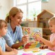 Montessori wooden educational clock toy for toddlers, featuring cartoon sliders and a child-friendly design for.
