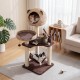 Multi-level cat tree in brown with a plush hammock and attached jingling balls, offering climbing and lounging fun for.