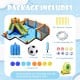 Giant inflatable water slide with dual water cannons, climbing wall, and soccer ball for outdoor fun for kids aged 3-12.
