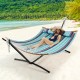Colorful 2-person hammock stand with carrying bag, featuring a sturdy powder-coated steel frame for outdoor relaxation.