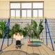 Extra-large A-frame swing stand in yellow, supporting 660 lbs, with anti-slip footpads for outdoor fun.