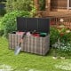 Gray 96-gallon PE wicker outdoor storage box with tools inside, featuring wheels for easy mobility and waterproof liner.
