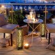 Two solar-powered diamond wicker floor lamps with warm yellow light, perfect for outdoor patio ambiance.