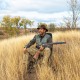Swivel folding chair with backrest and padded cushion in camouflage, ideal for hunting and outdoor activities.