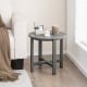 Gray 18-inch round weather-resistant Adirondack side table with slatted top, perfect for outdoor or bathroom use.