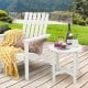 White 18-inch round weather-resistant side table with slatted top, perfect for outdoor use alongside Adirondack chairs.