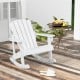 White outdoor wooden kid Adirondack rocking chair with slatted seat, perfect for relaxing on the patio.