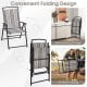 Gray patio folding sling chair with a space-saving design, featuring a breathable fabric surface for outdoor comfort.