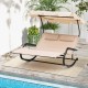Outdoor rocking chaise lounge for 2 with beige fabric, adjustable canopy, and wheels, perfect for poolside relaxation.