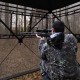 Hunting blind with a person aiming, featuring 270-degree see-through fabric and portable design for 2-3 people.