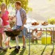 Folding fish cleaning table in white with double sinks, ideal for camping and picnics, shown in outdoor setting.