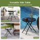 Black 18-inch folding side table with tempered glass top, ideal for indoor and outdoor use, shown by poolside.