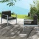 Contemporary gray sofa chairs with WPC armrests and cushions, perfect for outdoor relaxation by the water.