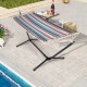 Multicolor hammock with stand, featuring a durable metal frame and hand-woven ropes, ideal for patio relaxation.